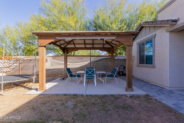 view of patio featuring a gazebo and a trampoline