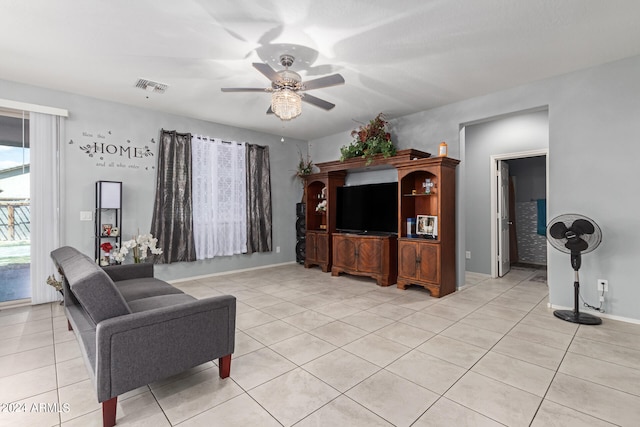 tiled living room with ceiling fan