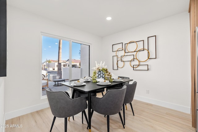 dining space featuring light hardwood / wood-style floors