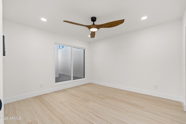 unfurnished room with ceiling fan and light wood-type flooring