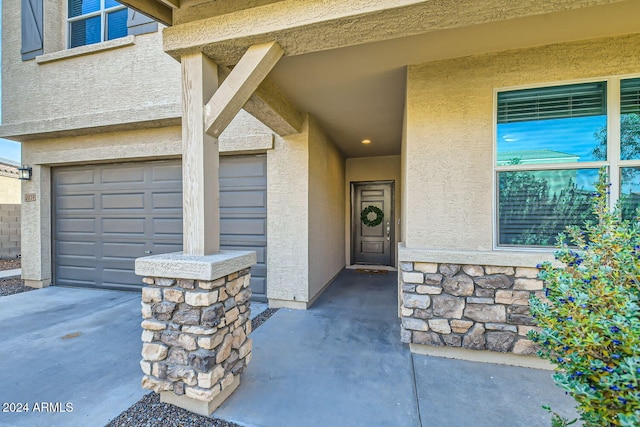 doorway to property featuring a garage