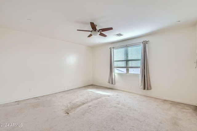 unfurnished room with ceiling fan and carpet floors