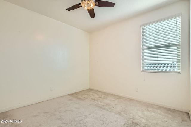 carpeted empty room with ceiling fan