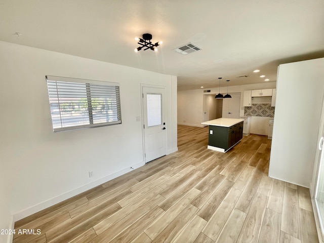 unfurnished living room featuring light wood-type flooring