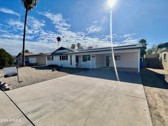 ranch-style home with a carport