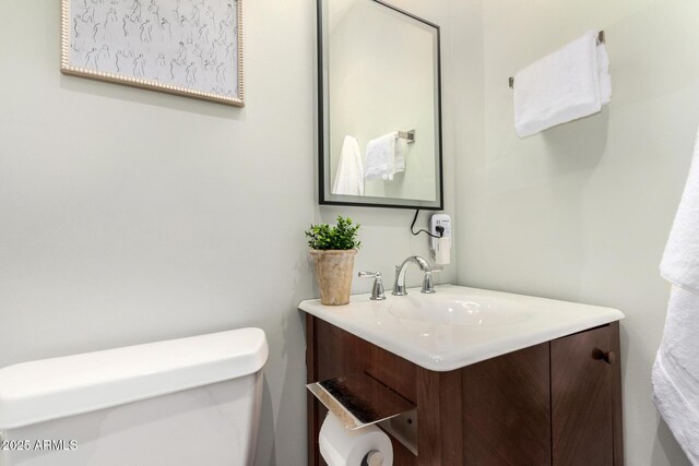 bathroom with toilet and vanity