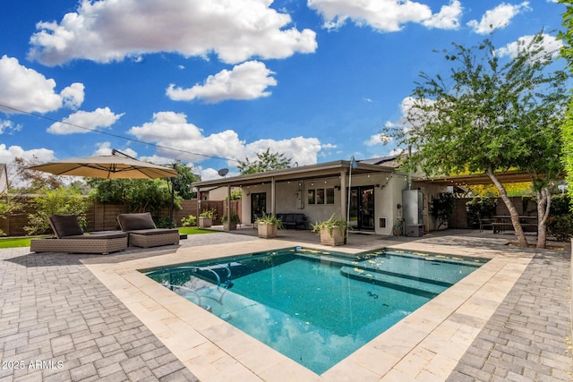 view of swimming pool featuring outdoor lounge area, a fenced in pool, a fenced backyard, french doors, and a patio