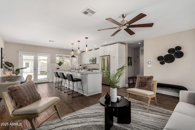 living room featuring recessed lighting, visible vents, french doors, dark wood-style flooring, and ceiling fan