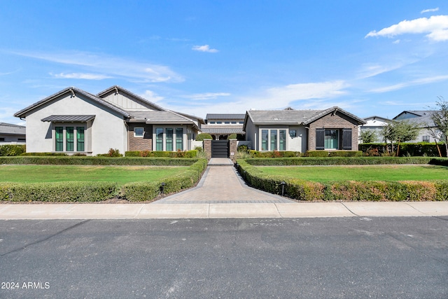 view of front of property with a front lawn