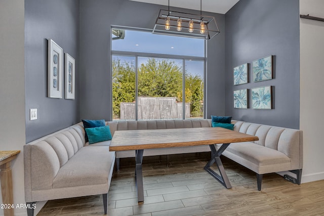 dining area with breakfast area and hardwood / wood-style flooring