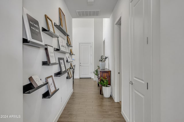 corridor with light wood-type flooring