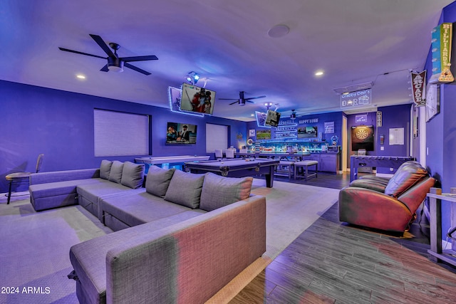 interior space featuring hardwood / wood-style flooring, pool table, bar area, and ceiling fan