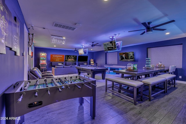 recreation room featuring hardwood / wood-style floors and ceiling fan