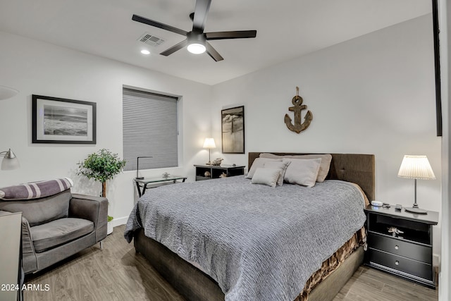 bedroom featuring hardwood / wood-style flooring and ceiling fan