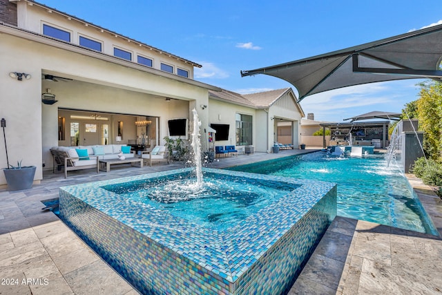 view of pool with a patio area, an outdoor hangout area, pool water feature, and an in ground hot tub