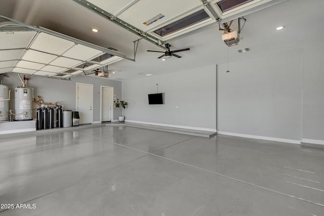 garage featuring a garage door opener and gas water heater