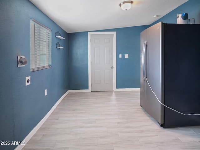 corridor featuring light hardwood / wood-style floors