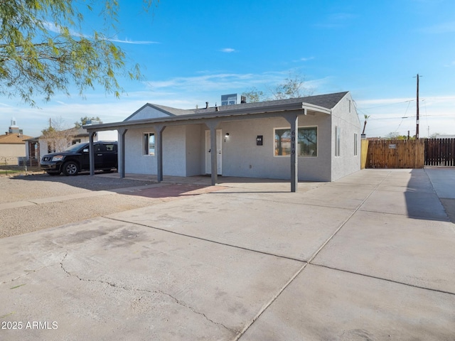 ranch-style house with a carport