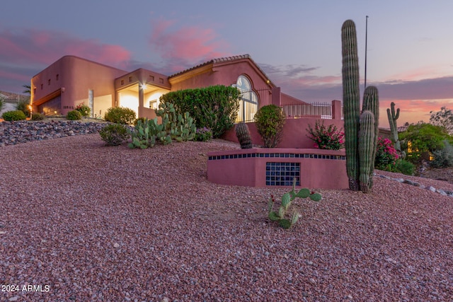 view of property exterior at dusk