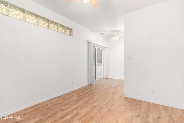 unfurnished room with light wood-type flooring and ceiling fan