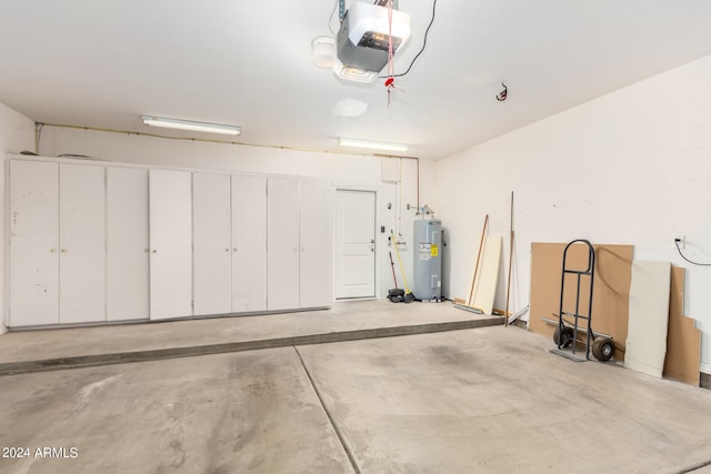 garage featuring a garage door opener and water heater