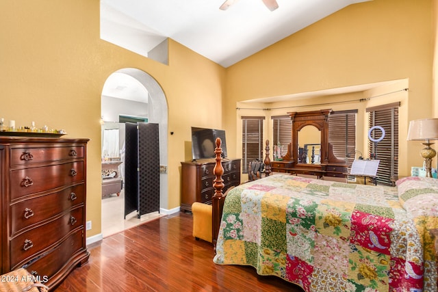 bedroom with ceiling fan, lofted ceiling, and dark wood-type flooring