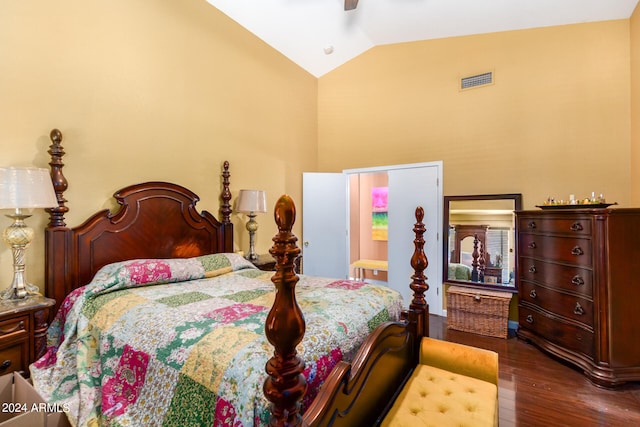 bedroom with ceiling fan, vaulted ceiling, and dark wood-type flooring