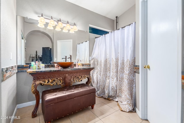 bathroom featuring tile patterned flooring and vanity