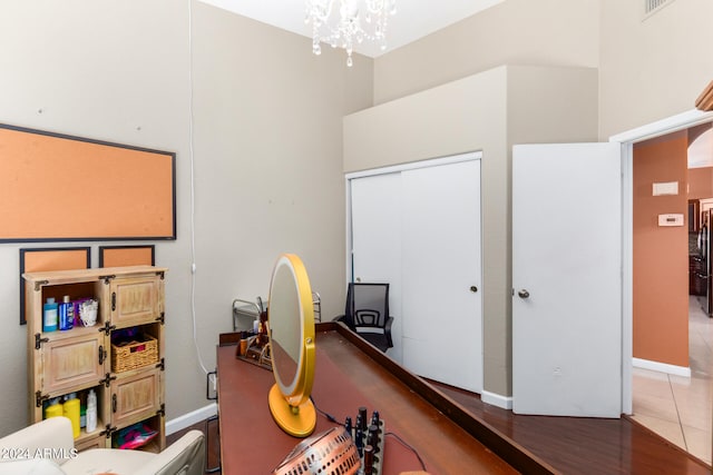 office space featuring an inviting chandelier and hardwood / wood-style flooring