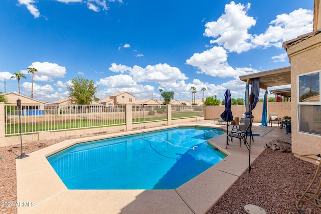 view of swimming pool with a patio area