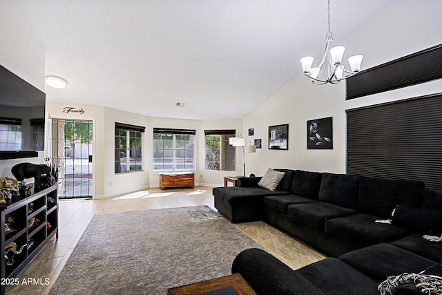 tiled living room featuring lofted ceiling, visible vents, a notable chandelier, and baseboards