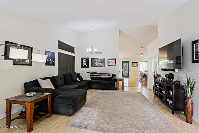 living room with high vaulted ceiling, a notable chandelier, and baseboards