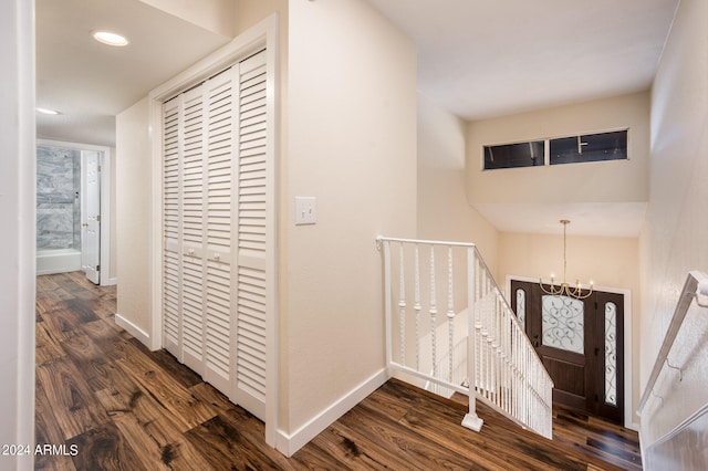 entryway featuring a chandelier and dark wood-type flooring