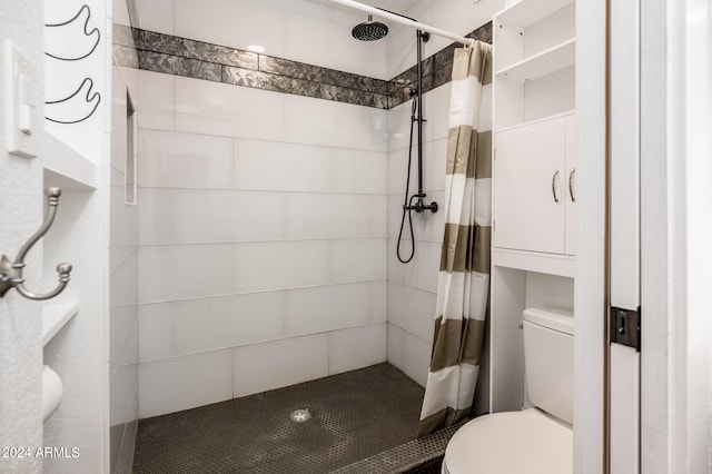 bathroom with walk in shower and toilet