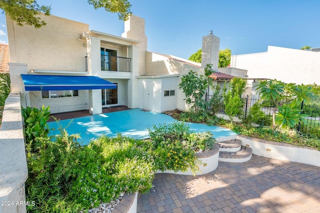 view of pool featuring a patio