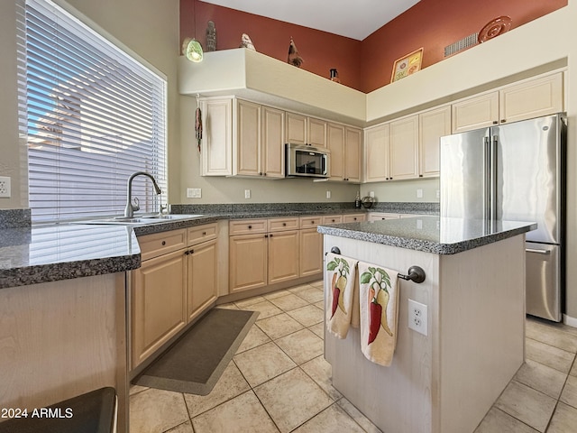 kitchen featuring sink, a center island, decorative light fixtures, light tile patterned floors, and appliances with stainless steel finishes