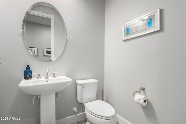 bathroom with toilet and sink