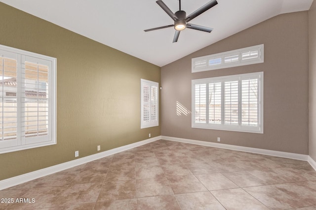 empty room featuring light tile patterned floors, baseboards, a ceiling fan, and lofted ceiling