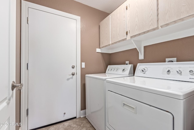 laundry area featuring cabinet space and washer and dryer