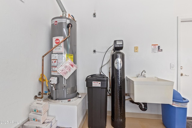 utilities with a sink and gas water heater