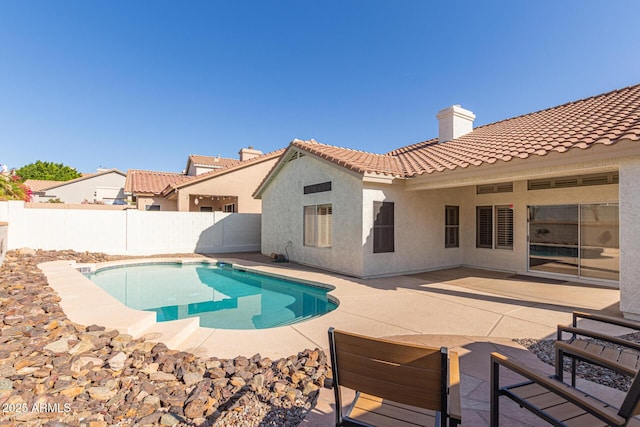 view of pool with a fenced backyard, a fenced in pool, and a patio area