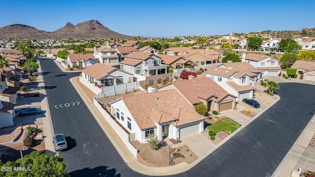 aerial view featuring a mountain view and a residential view