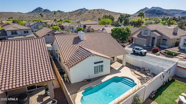 exterior space with a mountain view and a residential view