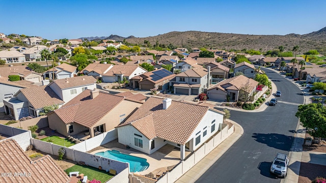 drone / aerial view featuring a residential view and a mountain view