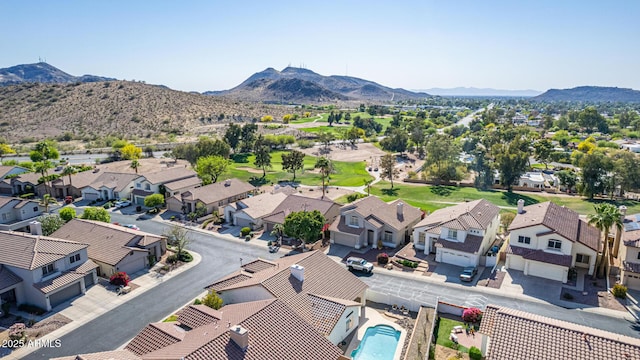 drone / aerial view featuring a residential view and a mountain view