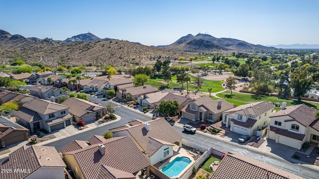birds eye view of property featuring a mountain view and a residential view