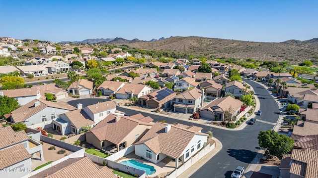 drone / aerial view featuring a residential view and a mountain view