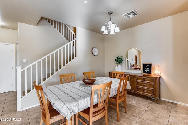 dining space with stairway, light tile patterned flooring, visible vents, and an inviting chandelier