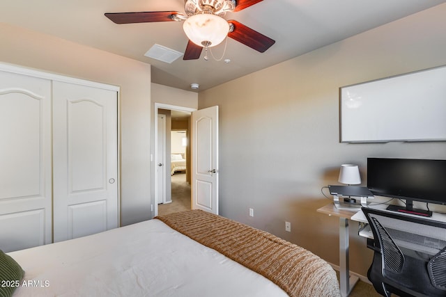 bedroom with ceiling fan, a closet, carpet flooring, and visible vents