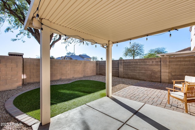 view of patio with a fenced backyard